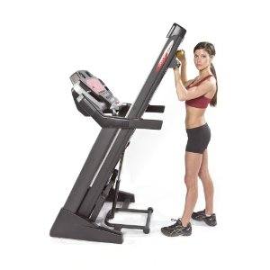 Girl Folding Treadmill