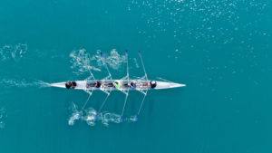 Rowing Team in Blue Waters
