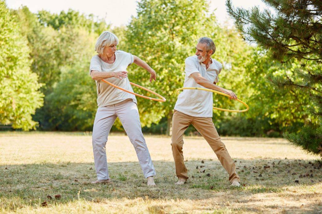 two seniors doing exercise