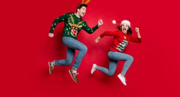 Woman and Man Running to Grab Christmas Deals