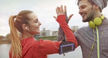 Couple high fiving in workout gear